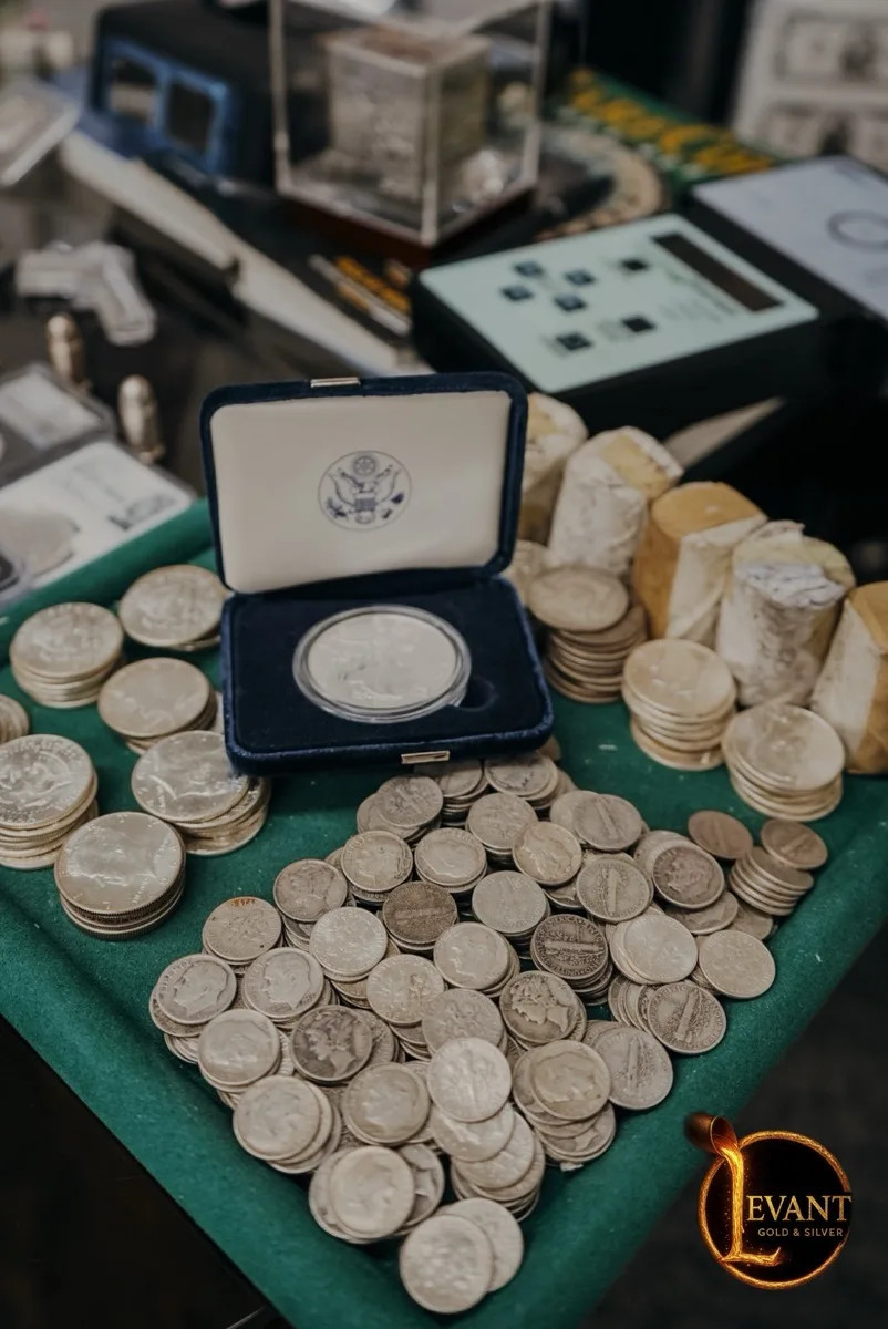 Junk silver coins — quarters and dimes laid out